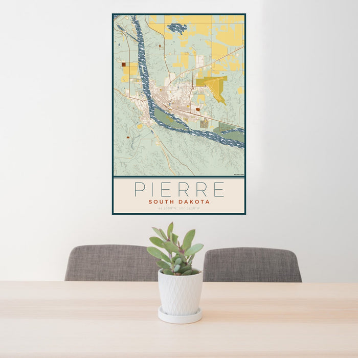 24x36 Pierre South Dakota Map Print Portrait Orientation in Woodblock Style Behind 2 Chairs Table and Potted Plant