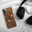 Custom Pierre South Dakota Map Phone Case in Ember on Table with Black Headphones