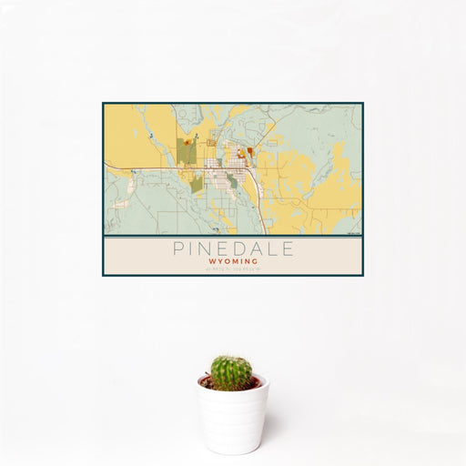 12x18 Pinedale Wyoming Map Print Landscape Orientation in Woodblock Style With Small Cactus Plant in White Planter