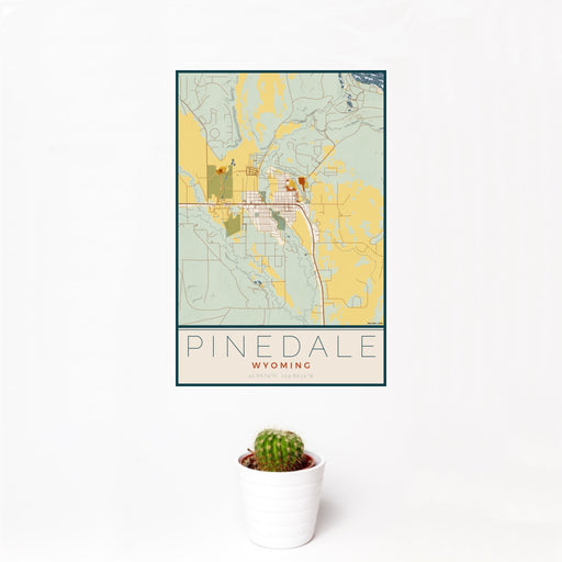 12x18 Pinedale Wyoming Map Print Portrait Orientation in Woodblock Style With Small Cactus Plant in White Planter