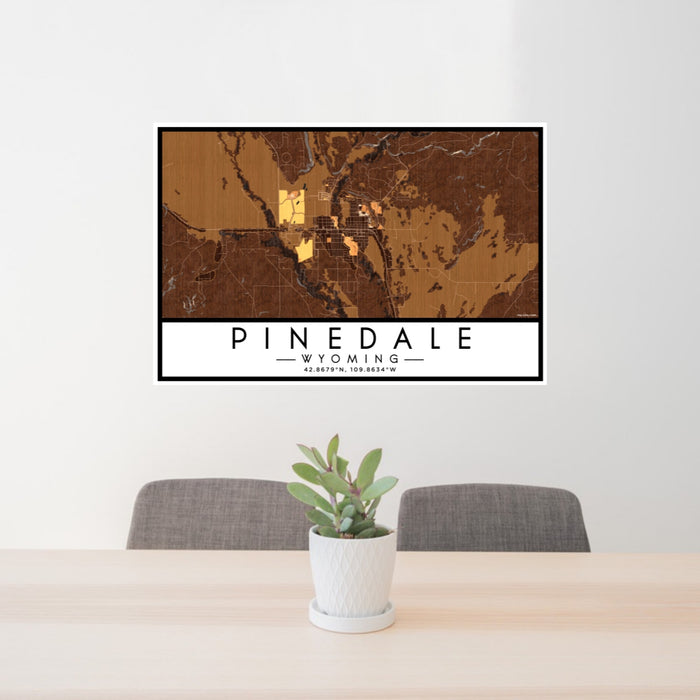 24x36 Pinedale Wyoming Map Print Lanscape Orientation in Ember Style Behind 2 Chairs Table and Potted Plant