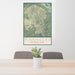 24x36 Pinnacles National Park Map Print Portrait Orientation in Woodblock Style Behind 2 Chairs Table and Potted Plant