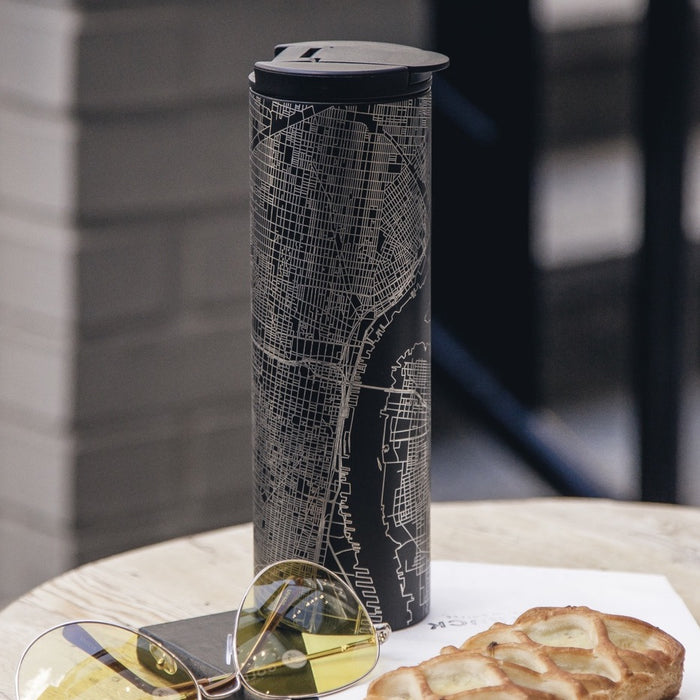 17oz Stainless Steel Insulated Tumbler in Black with Custom Engraving of Map on Table Next to Sunglasses and Pastry