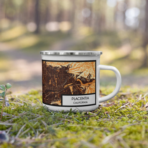 Right View Custom Placentia California Map Enamel Mug in Ember on Grass With Trees in Background