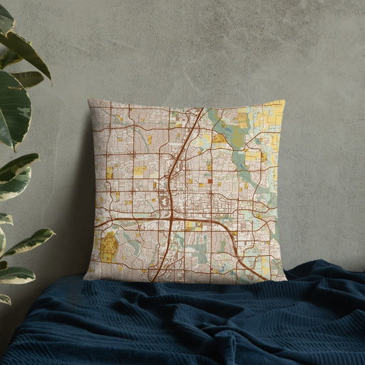 Custom Plano Texas Map Throw Pillow in Woodblock on Bedding Against Wall