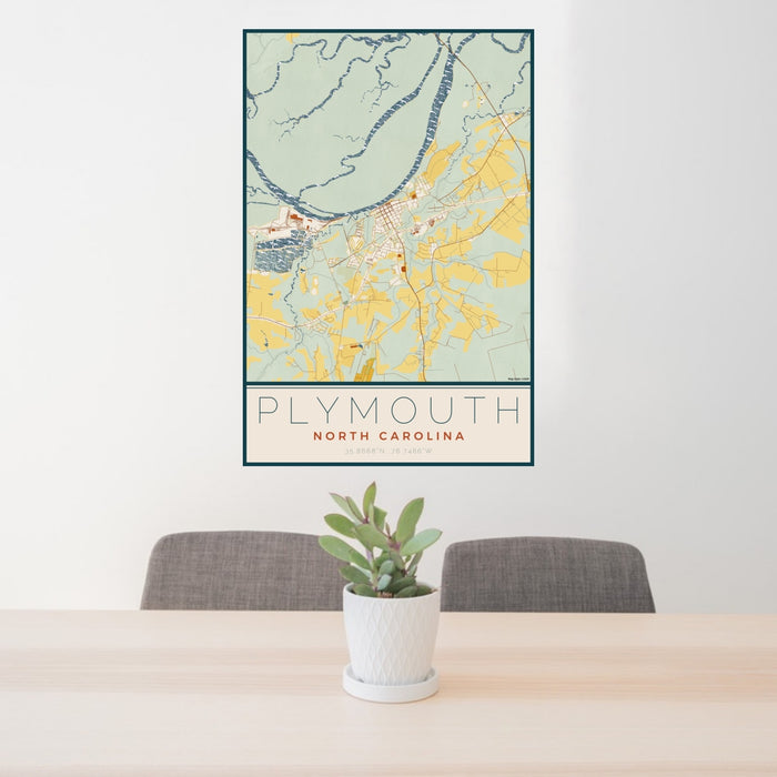 24x36 Plymouth North Carolina Map Print Portrait Orientation in Woodblock Style Behind 2 Chairs Table and Potted Plant
