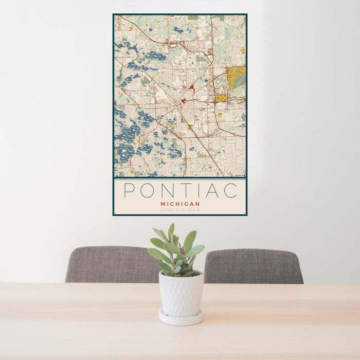 24x36 Pontiac Michigan Map Print Portrait Orientation in Woodblock Style Behind 2 Chairs Table and Potted Plant