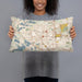 Person holding 20x12 Custom Pontiac Michigan Map Throw Pillow in Woodblock