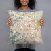 Person holding 18x18 Custom Pontiac Michigan Map Throw Pillow in Woodblock