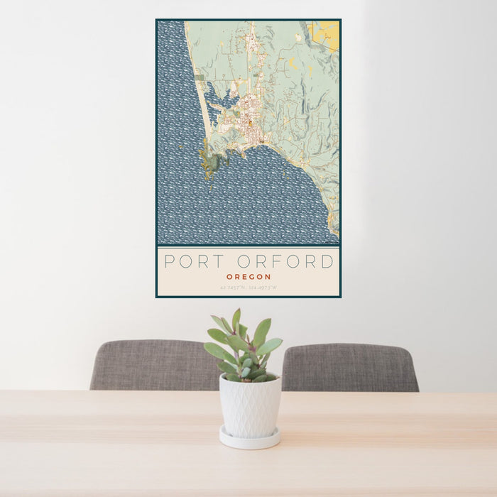 24x36 Port Orford Oregon Map Print Portrait Orientation in Woodblock Style Behind 2 Chairs Table and Potted Plant