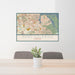 24x36 Port Salerno Florida Map Print Lanscape Orientation in Woodblock Style Behind 2 Chairs Table and Potted Plant
