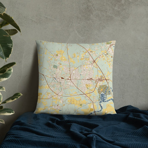 Custom Prattville Alabama Map Throw Pillow in Woodblock on Bedding Against Wall