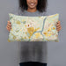 Person holding 20x12 Custom Princeton New Jersey Map Throw Pillow in Woodblock