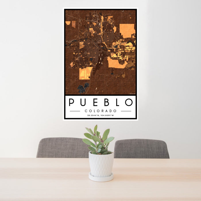 24x36 Pueblo Colorado Map Print Portrait Orientation in Ember Style Behind 2 Chairs Table and Potted Plant