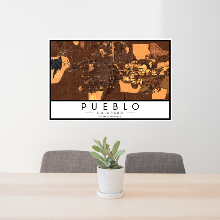 24x36 Pueblo Colorado Map Print Landscape Orientation in Ember Style Behind 2 Chairs Table and Potted Plant