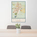 24x36 Pueblo Colorado Map Print Portrait Orientation in Woodblock Style Behind 2 Chairs Table and Potted Plant