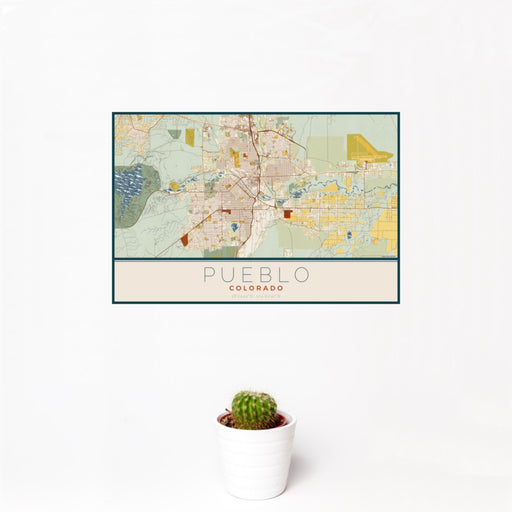 12x18 Pueblo Colorado Map Print Landscape Orientation in Woodblock Style With Small Cactus Plant in White Planter