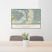 24x36 Puget Sound Washington Map Print Lanscape Orientation in Woodblock Style Behind 2 Chairs Table and Potted Plant
