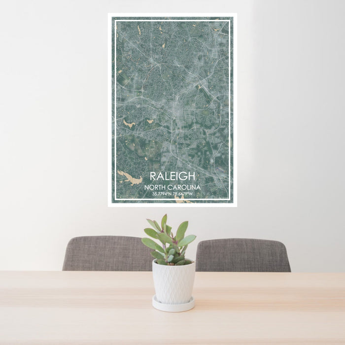24x36 Raleigh North Carolina Map Print Portrait Orientation in Afternoon Style Behind 2 Chairs Table and Potted Plant