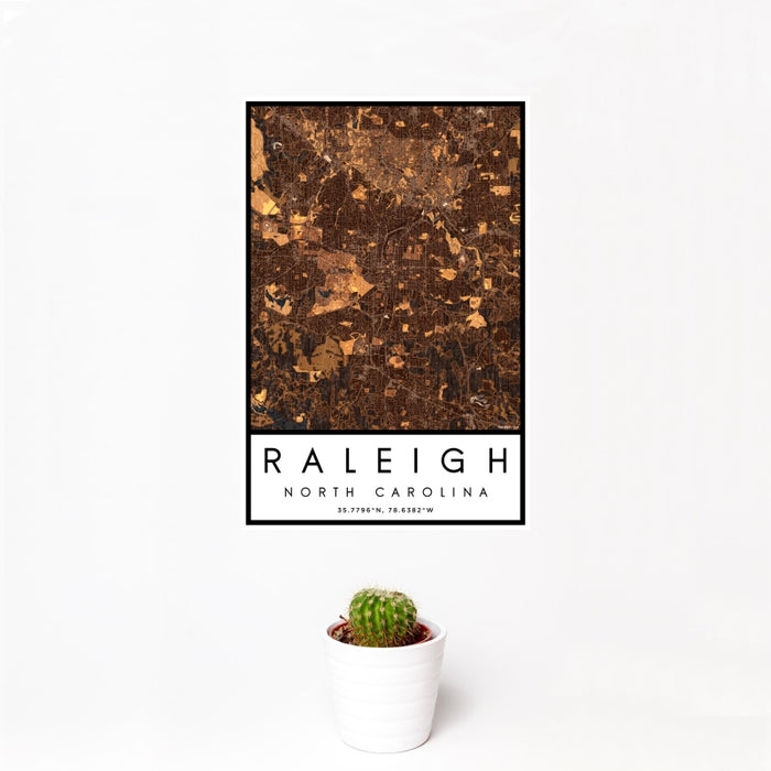 12x18 Raleigh North Carolina Map Print Portrait Orientation in Ember Style With Small Cactus Plant in White Planter