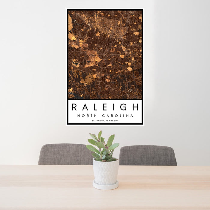24x36 Raleigh North Carolina Map Print Portrait Orientation in Ember Style Behind 2 Chairs Table and Potted Plant
