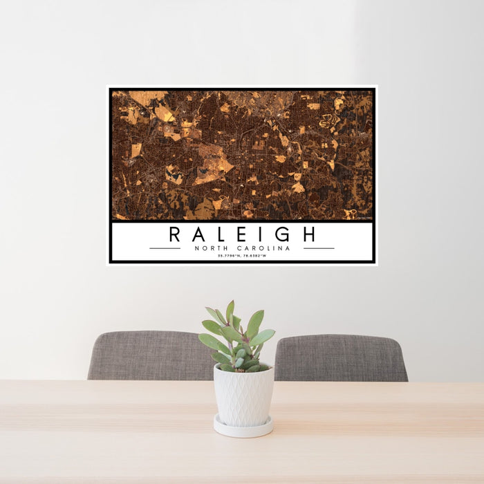 24x36 Raleigh North Carolina Map Print Landscape Orientation in Ember Style Behind 2 Chairs Table and Potted Plant