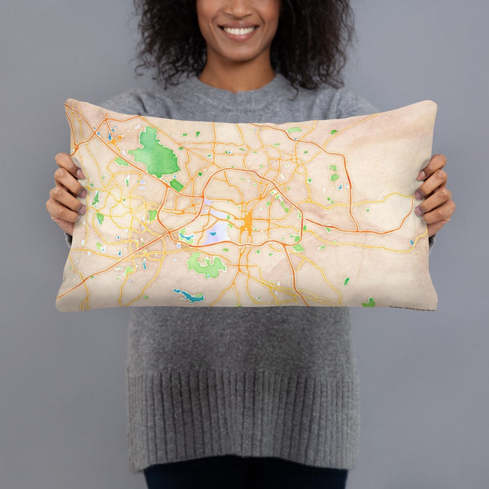 Person holding 20x12 Custom Raleigh North Carolina Map Throw Pillow in Watercolor