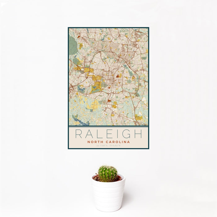 12x18 Raleigh North Carolina Map Print Portrait Orientation in Woodblock Style With Small Cactus Plant in White Planter