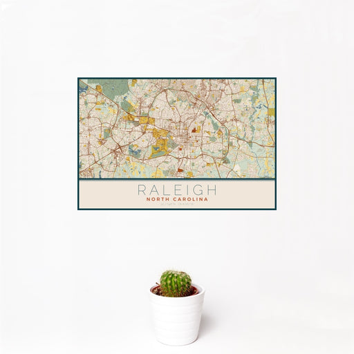 12x18 Raleigh North Carolina Map Print Landscape Orientation in Woodblock Style With Small Cactus Plant in White Planter