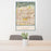 24x36 Rancho Cucamonga California Map Print Portrait Orientation in Woodblock Style Behind 2 Chairs Table and Potted Plant