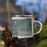 Right View Custom Randolph Wisconsin Map Enamel Mug in Afternoon on Grass With Trees in Background