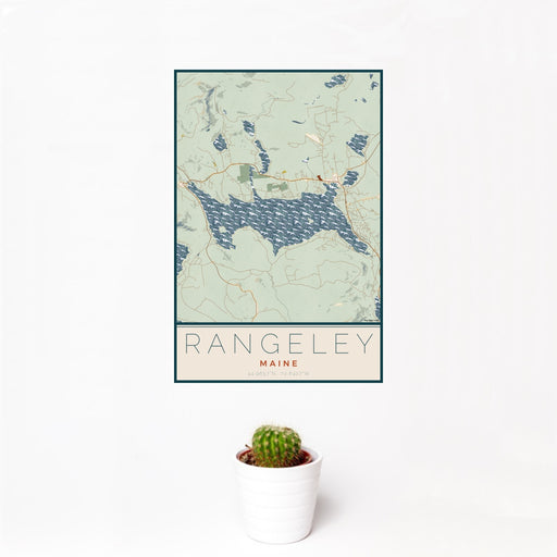 12x18 Rangeley Maine Map Print Portrait Orientation in Woodblock Style With Small Cactus Plant in White Planter