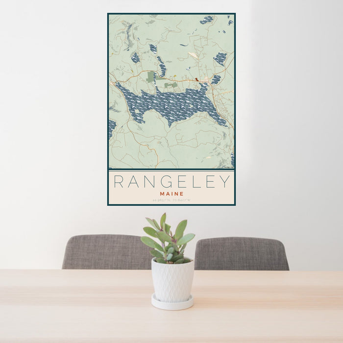 24x36 Rangeley Maine Map Print Portrait Orientation in Woodblock Style Behind 2 Chairs Table and Potted Plant