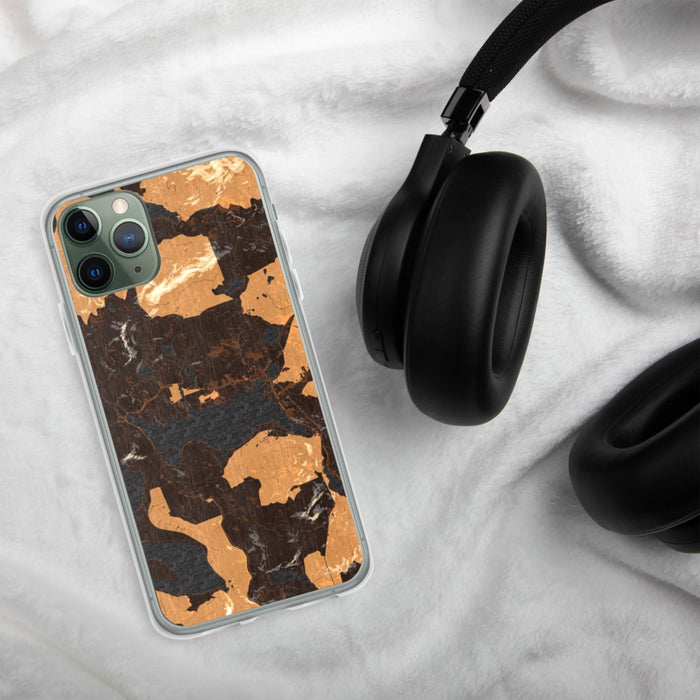 Custom Rangeley Maine Map Phone Case in Ember on Table with Black Headphones