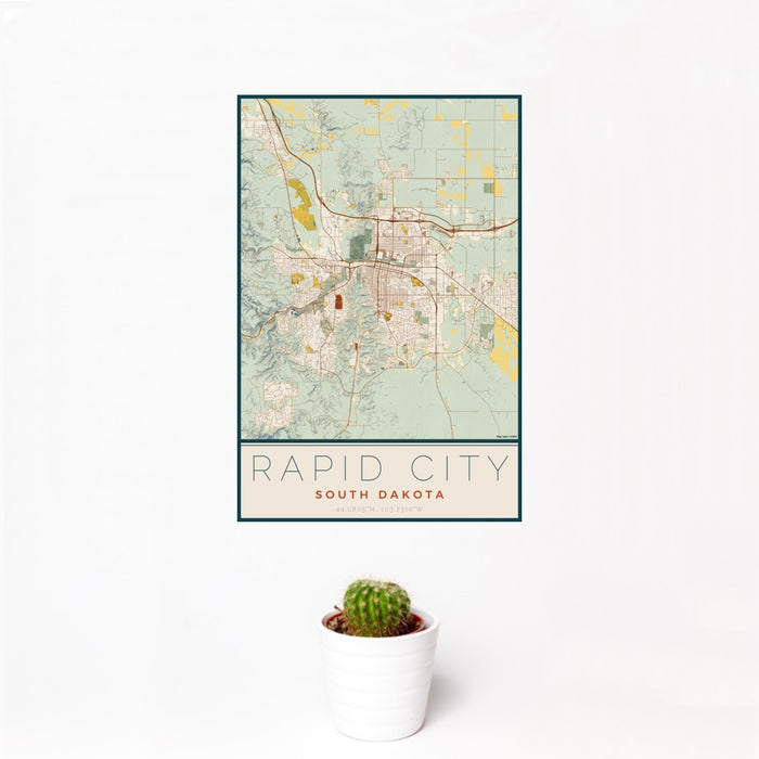 12x18 Rapid City South Dakota Map Print Portrait Orientation in Woodblock Style With Small Cactus Plant in White Planter