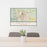 24x36 Rapid City South Dakota Map Print Landscape Orientation in Woodblock Style Behind 2 Chairs Table and Potted Plant