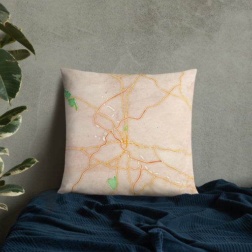 Custom Reading Pennsylvania Map Throw Pillow in Watercolor on Bedding Against Wall