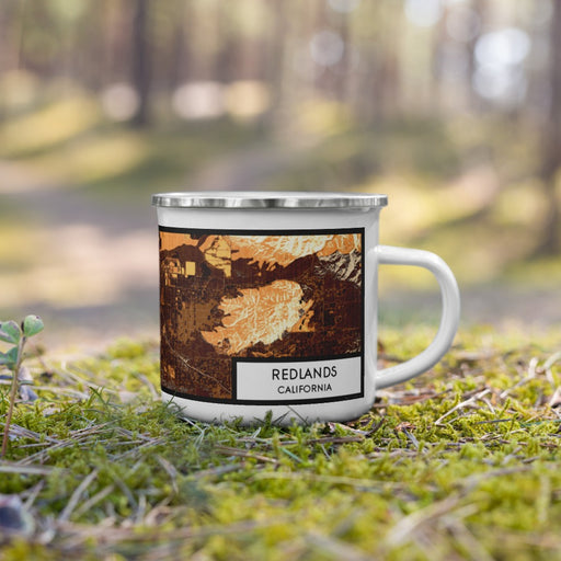 Right View Custom Redlands California Map Enamel Mug in Ember on Grass With Trees in Background
