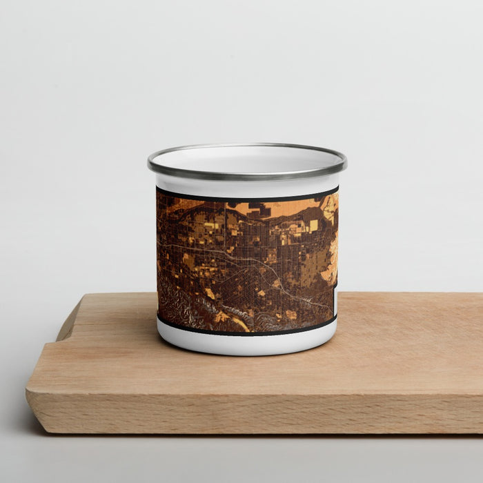 Front View Custom Redlands California Map Enamel Mug in Ember on Cutting Board