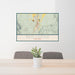 24x36 Red Lodge Montana Map Print Landscape Orientation in Woodblock Style Behind 2 Chairs Table and Potted Plant