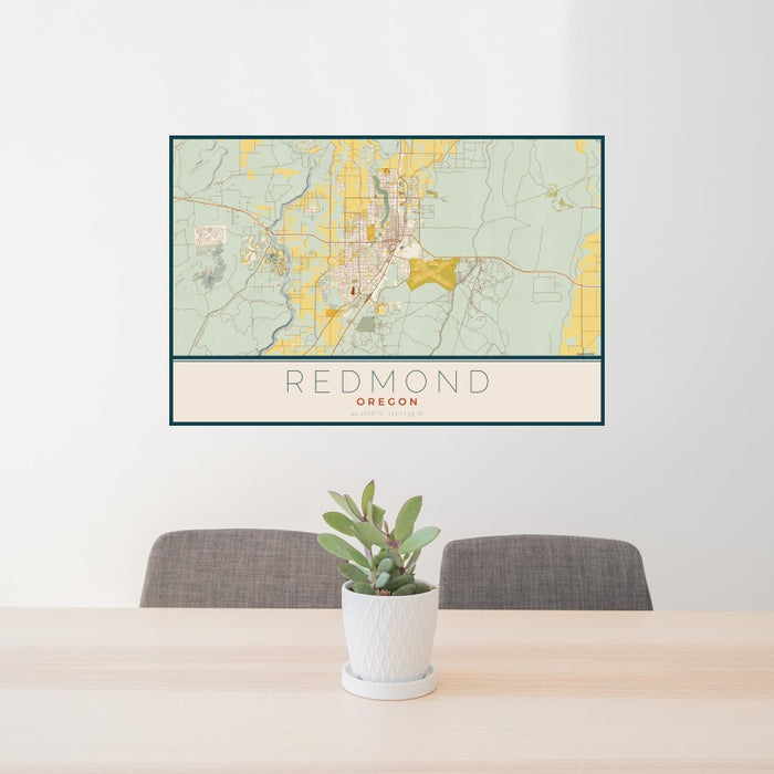 24x36 Redmond Oregon Map Print Landscape Orientation in Woodblock Style Behind 2 Chairs Table and Potted Plant