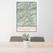24x36 Red River New Mexico Map Print Portrait Orientation in Woodblock Style Behind 2 Chairs Table and Potted Plant