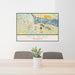 24x36 Red Wing Minnesota Map Print Lanscape Orientation in Woodblock Style Behind 2 Chairs Table and Potted Plant