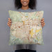 Person holding 18x18 Custom Reno Nevada Map Throw Pillow in Woodblock