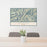 24x36 Riggins Idaho Map Print Lanscape Orientation in Woodblock Style Behind 2 Chairs Table and Potted Plant