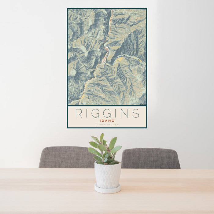 24x36 Riggins Idaho Map Print Portrait Orientation in Woodblock Style Behind 2 Chairs Table and Potted Plant