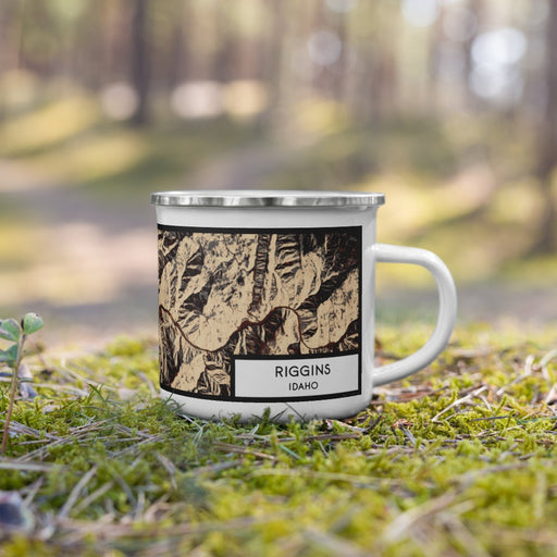 Right View Custom Riggins Idaho Map Enamel Mug in Ember on Grass With Trees in Background
