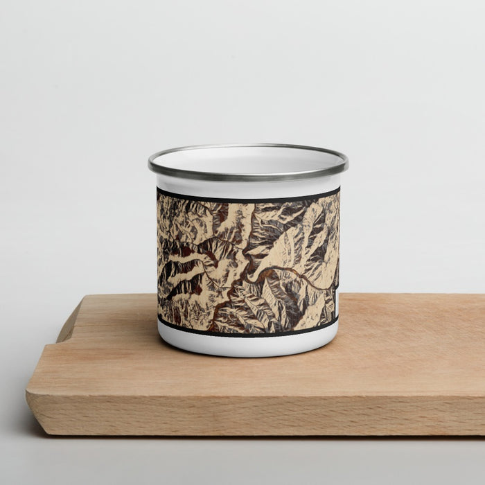 Front View Custom Riggins Idaho Map Enamel Mug in Ember on Cutting Board