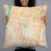 Person holding 22x22 Custom Rittenhouse Square Pennsylvania Map Throw Pillow in Watercolor