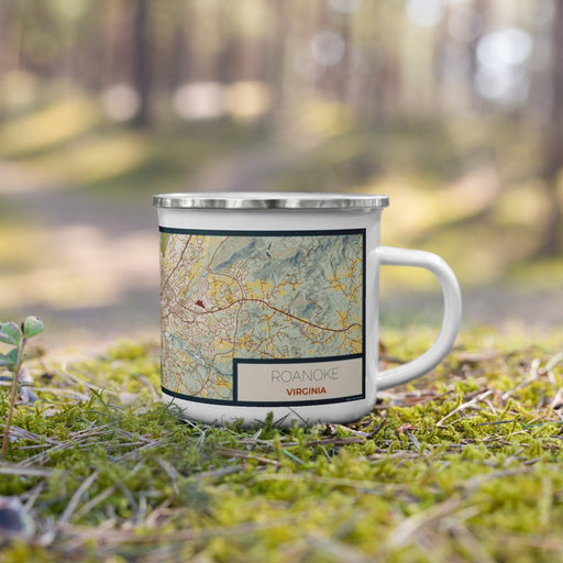 Right View Custom Roanoke Virginia Map Enamel Mug in Woodblock on Grass With Trees in Background